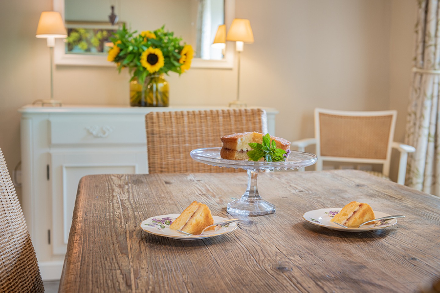 Farmhouse dining room with sunflowers and sponge cake