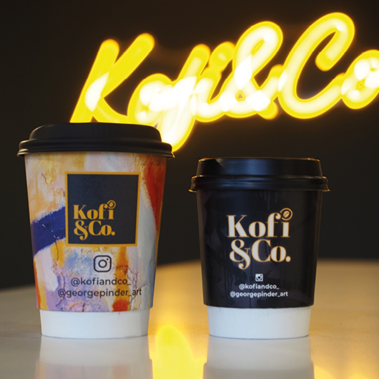 Kofi & Co takeaway drinks cups with Georges artwork printed onto them
