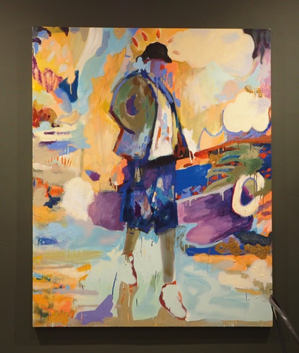 Large abstract painting with a figure in the foreground